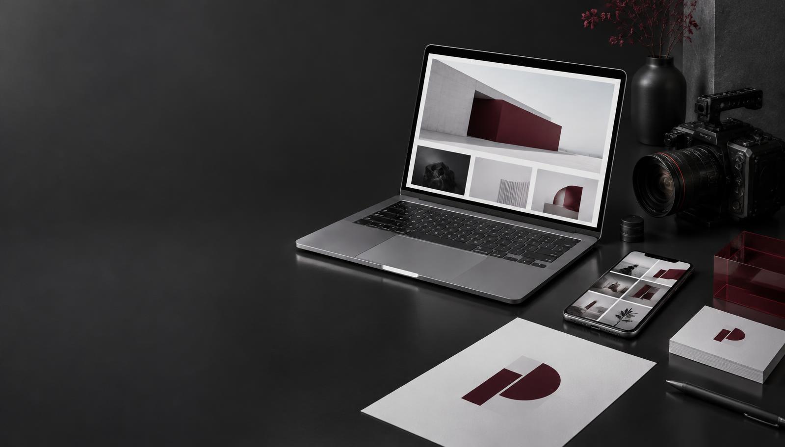 Illustrative creative services workspace with website, brand identity and video equipment